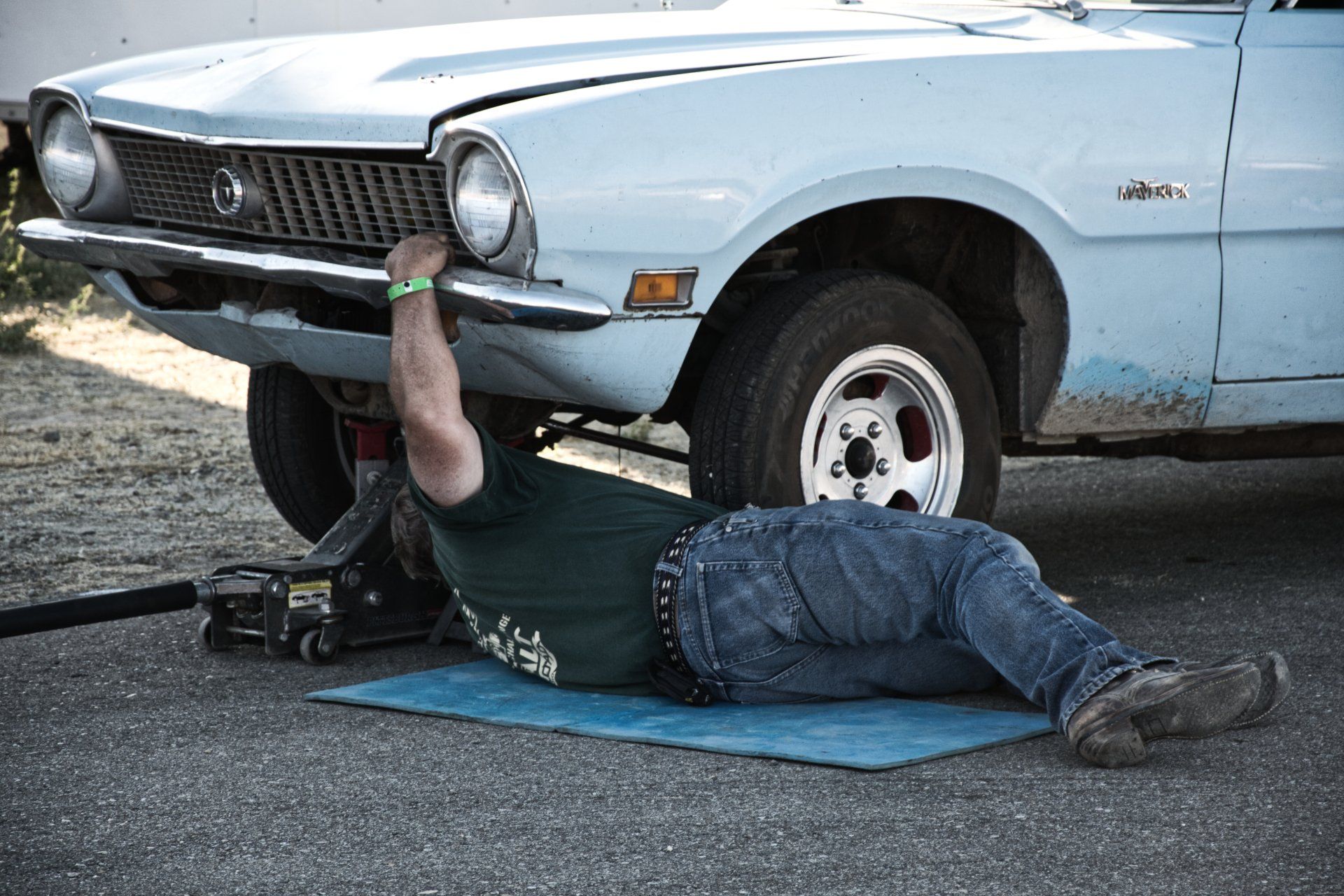 Mechanic working underneath a car